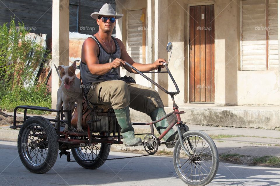 Cuban People.Dog on bike 