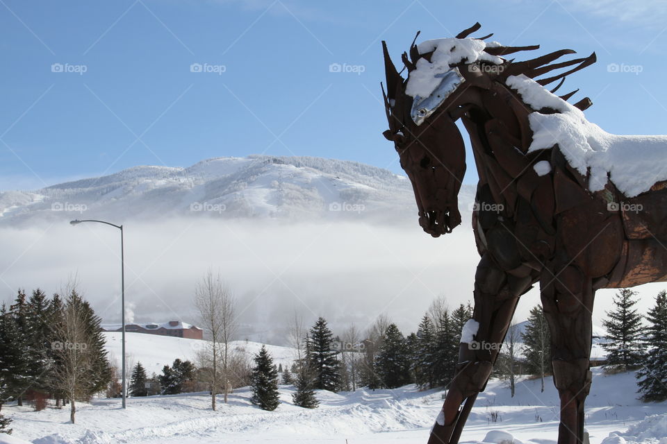 Horse statue near ski mountain