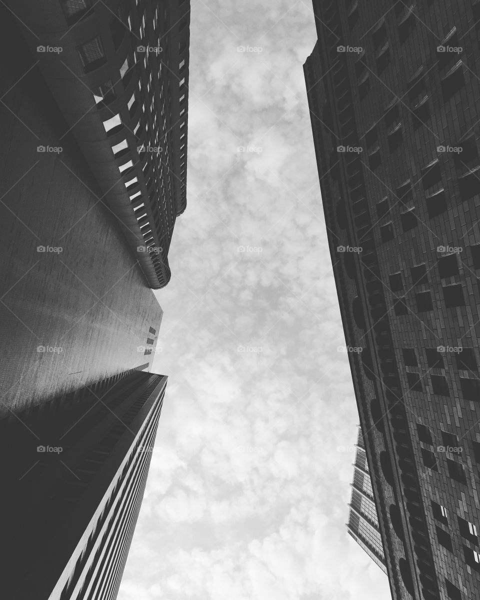 Looking up from the middle of the financial district in New York City.