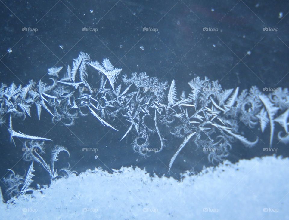 Frost patterns on a window.