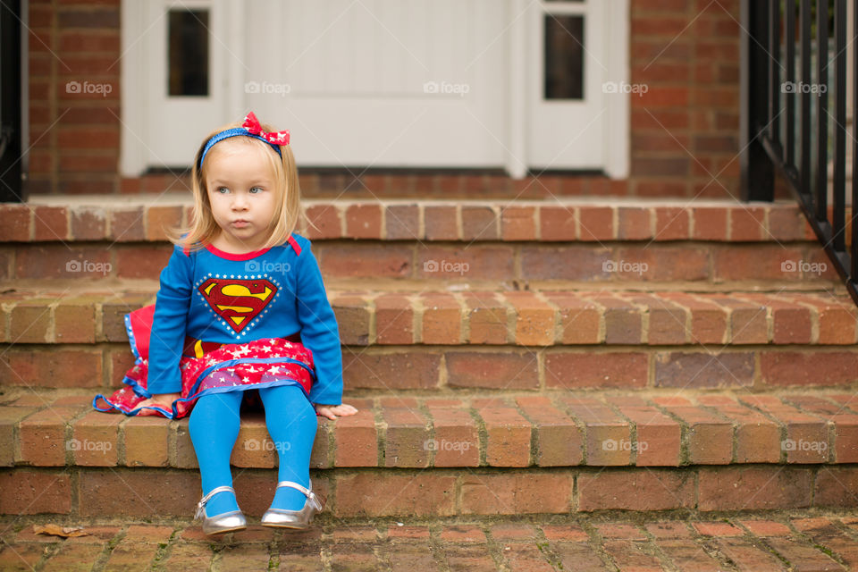 Cute little girl wearing super hero costume