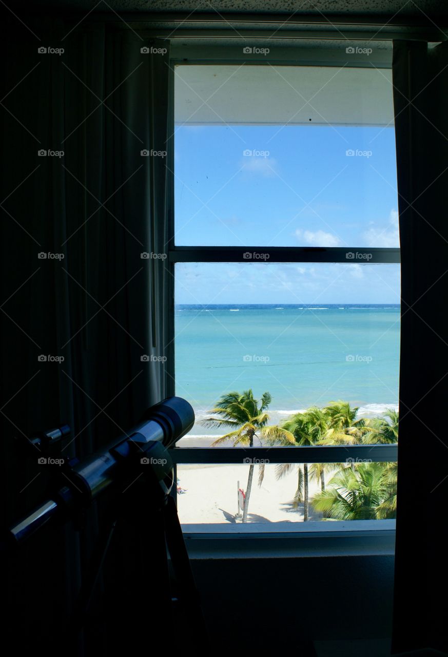 Telescope view out of window at beach San Juan Puerto Rico