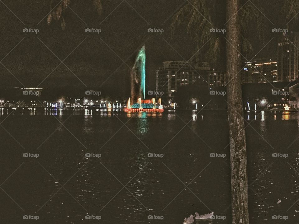 Watching the fountain light up the town with all its beauty 