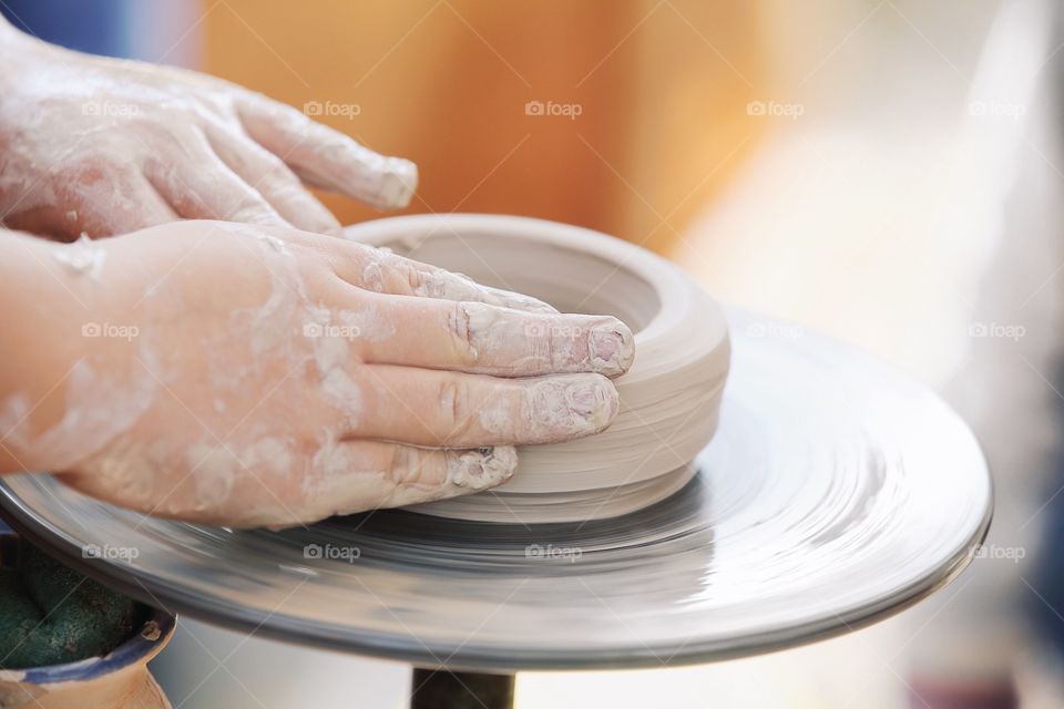 Making clay pottery