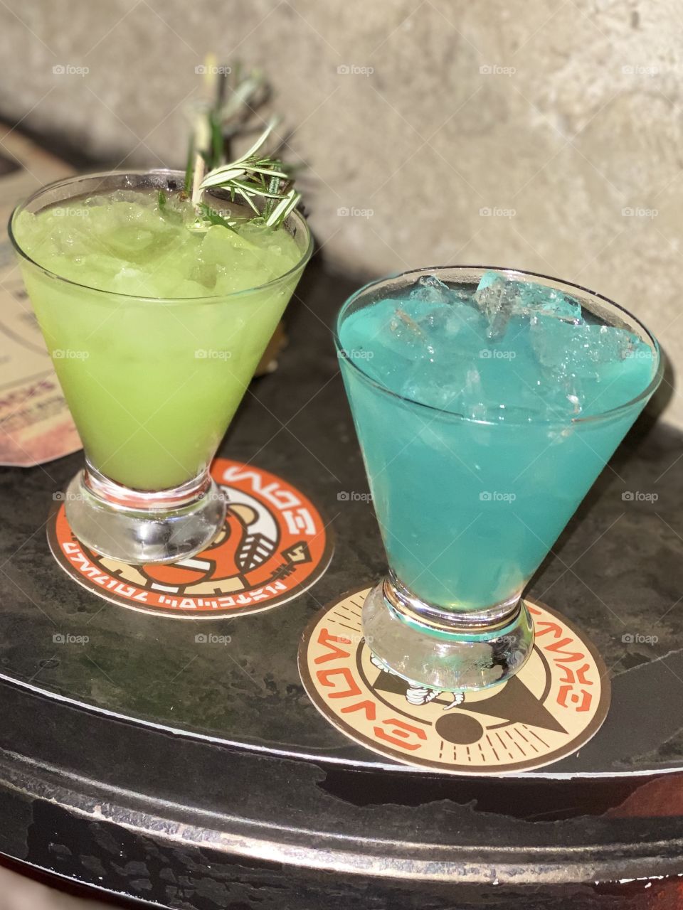 Colorful drinks sit on a table at the fun bar at Hollywood Studios at Walt Disney World.