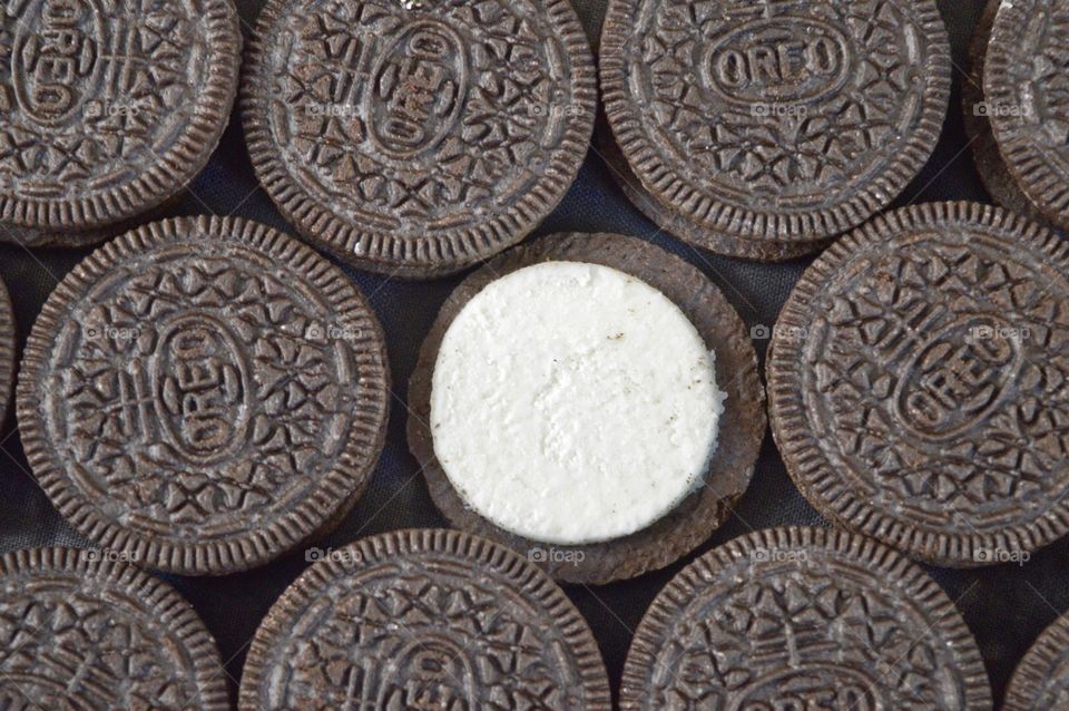 Contrasting Oreo cookies on a black background 