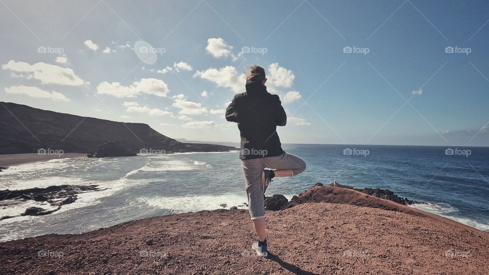 Joga on a cliff