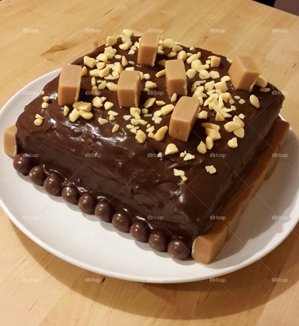 Square Chocolate Fudge Cake With Vanilla Fudge Chunks And Honeycomb Decoration and Malteasers