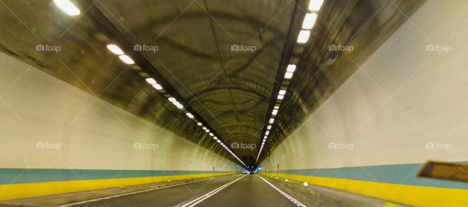 Best of the best: There are smooth lines, lights and road to the end point in the semicircle tunnel that has a long distance visual beauty.