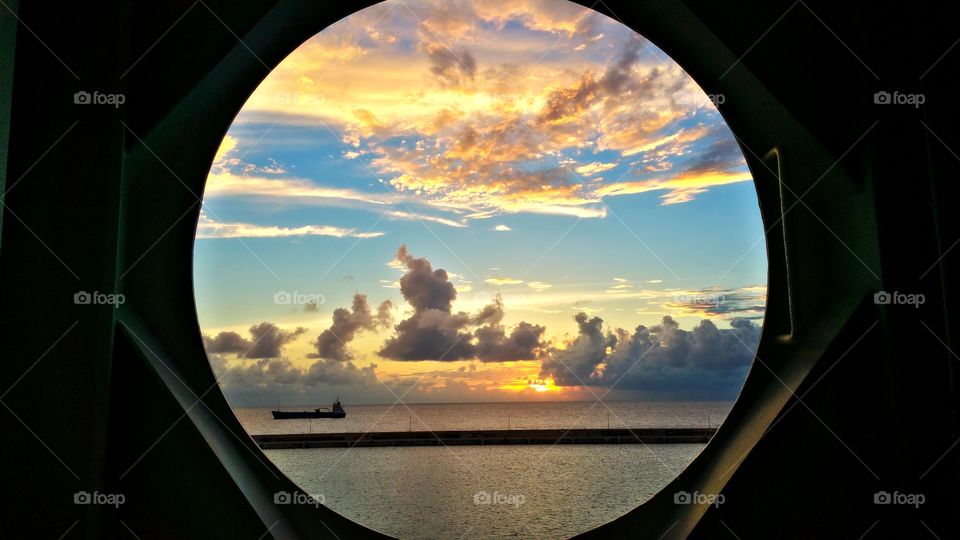 View of tanker ship from Port hole on Cruise ship