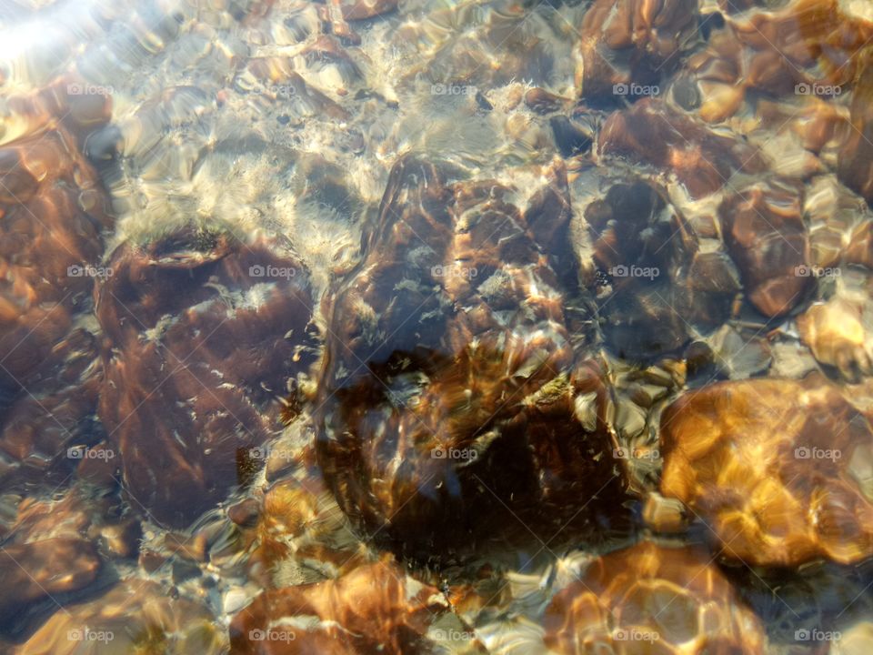 Stones under shallow water