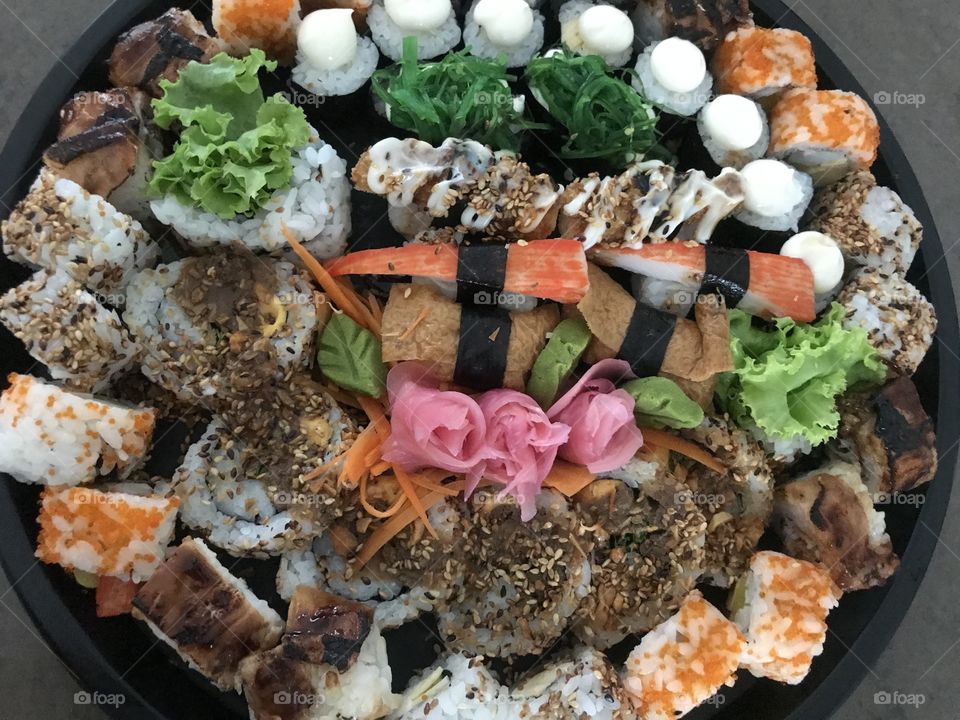 A plate of colorful sushi