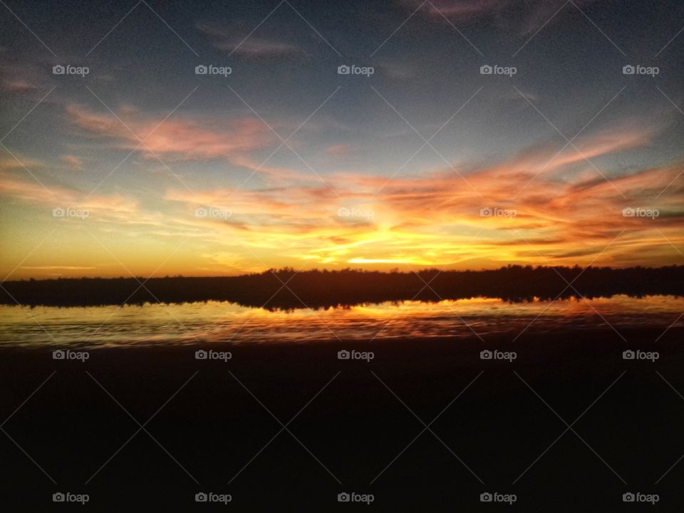 sunset reflection in the water,sunset,reflection,water,seeing double,double,colorful,nature,landscape