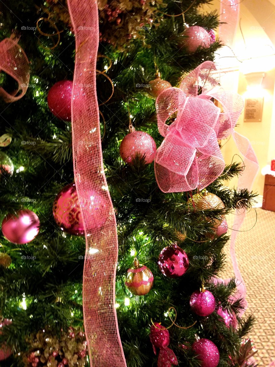 Pink bows on a Christmas tree