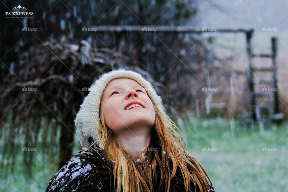 Girl enjoing the first snow of the year.