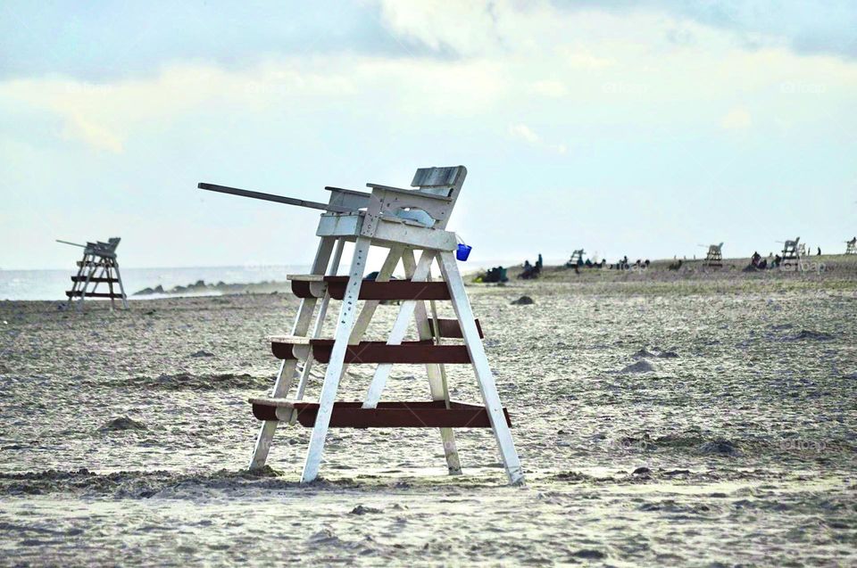 A tall chair on beach.