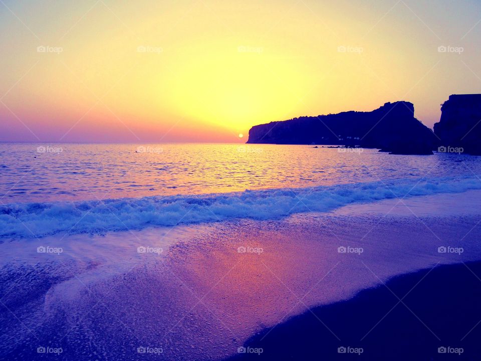 The sea of Praia at sunset. ( Italy ).