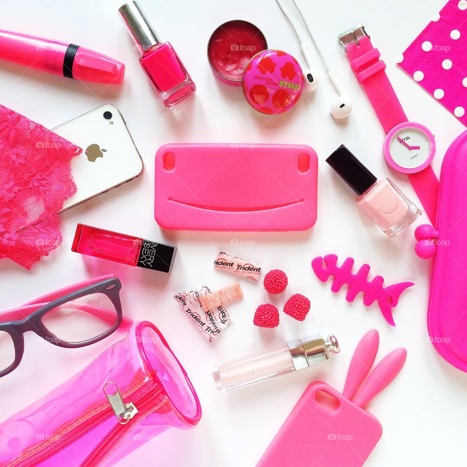 bright pink flat lay of female objects