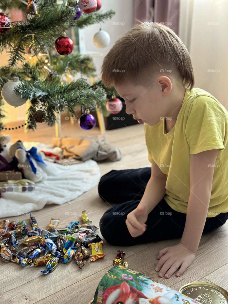 Boy and gifts happy new year 