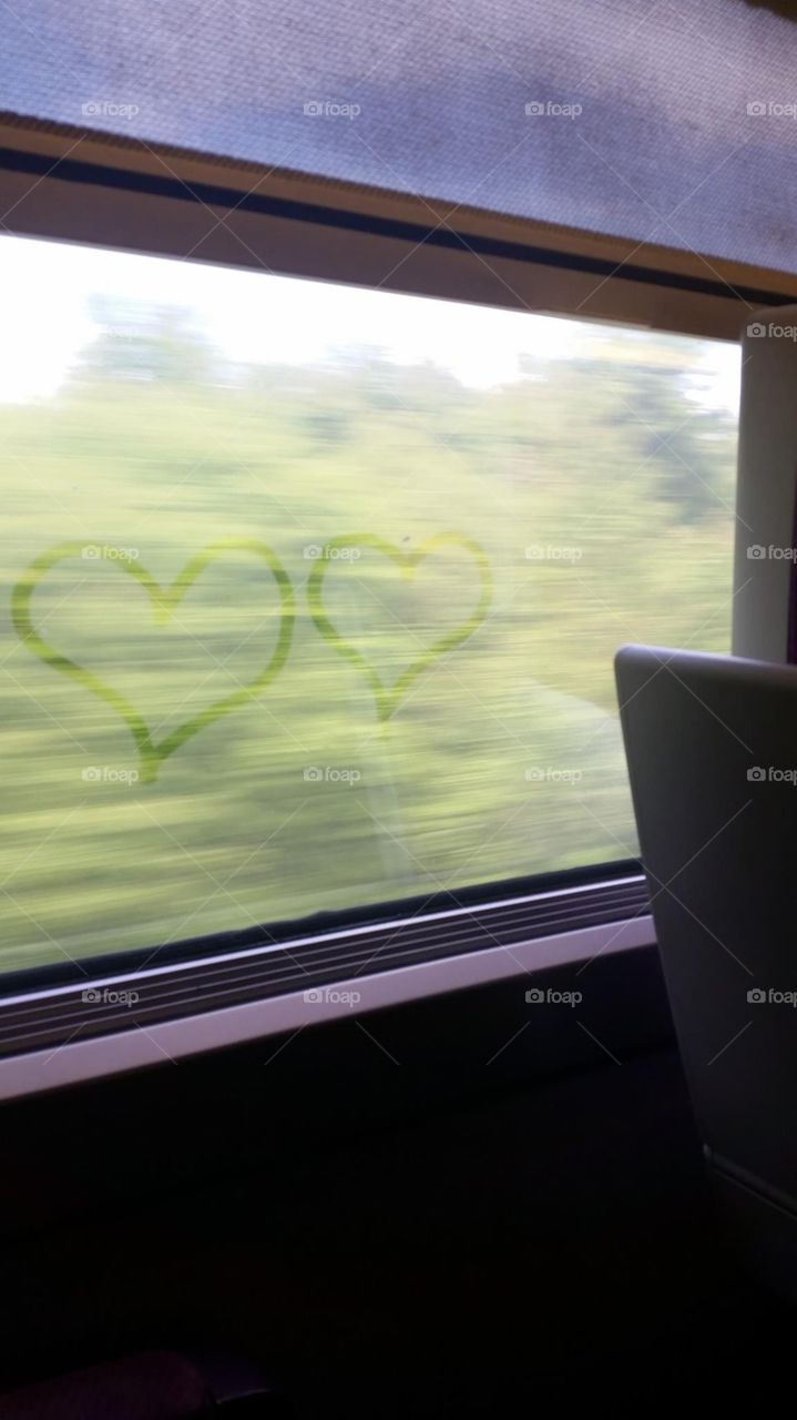 Double heart on the window of train