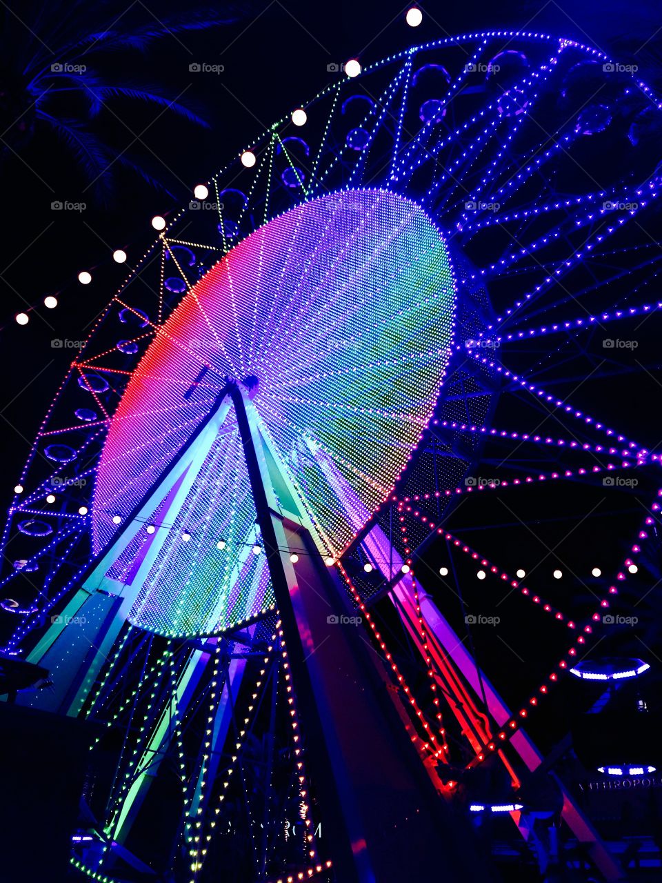 Illuminated ferris wheel at night