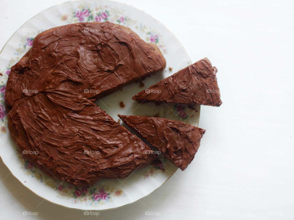 Brownie dessert homemade on a Japanese dish, sliced in the form of a pacman
