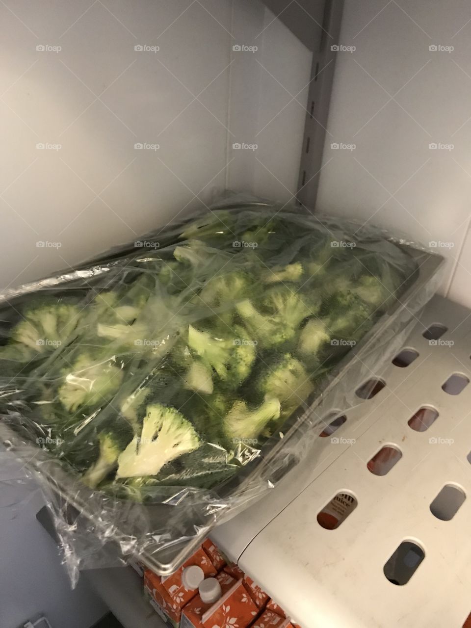 Food preparation at a restaurant. Just broccolis, nothing special. They tasted really good though, and looked really green and fresh.