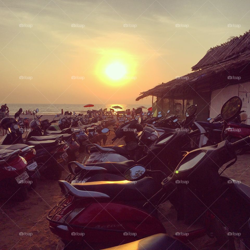 Bike parking and sunset . Bike parking in Goa and peaceful sunset
