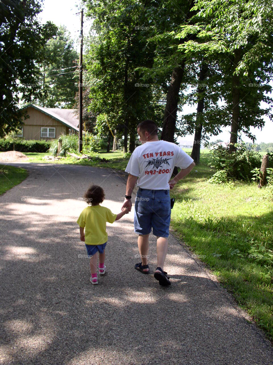 Father walks with daughter