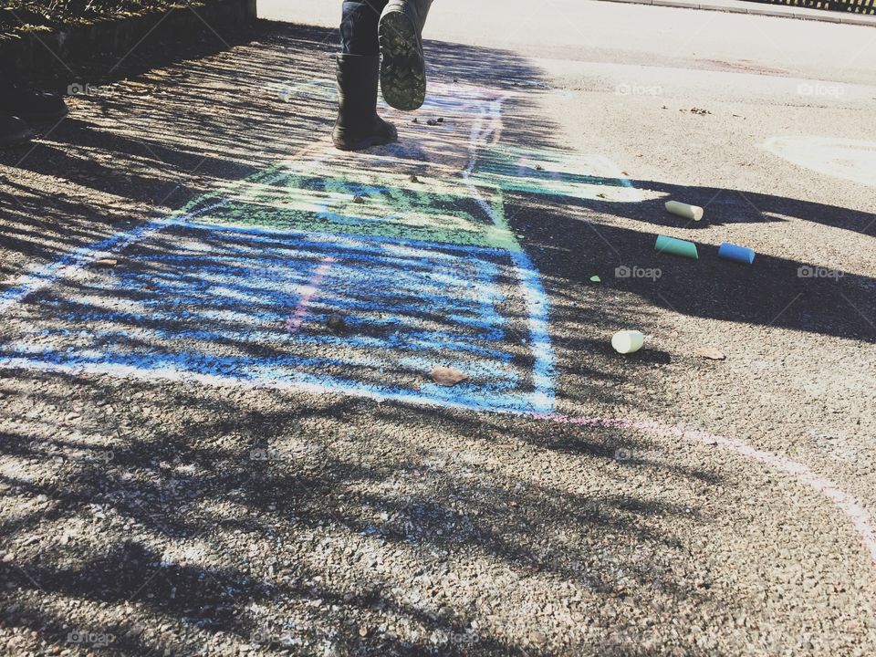 Kid using chalk crayons