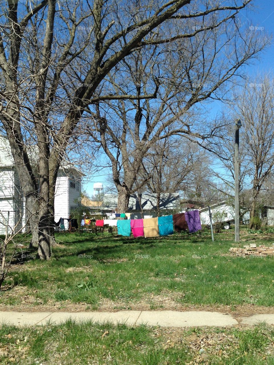 Bright colored clothing hanging on a clothesline