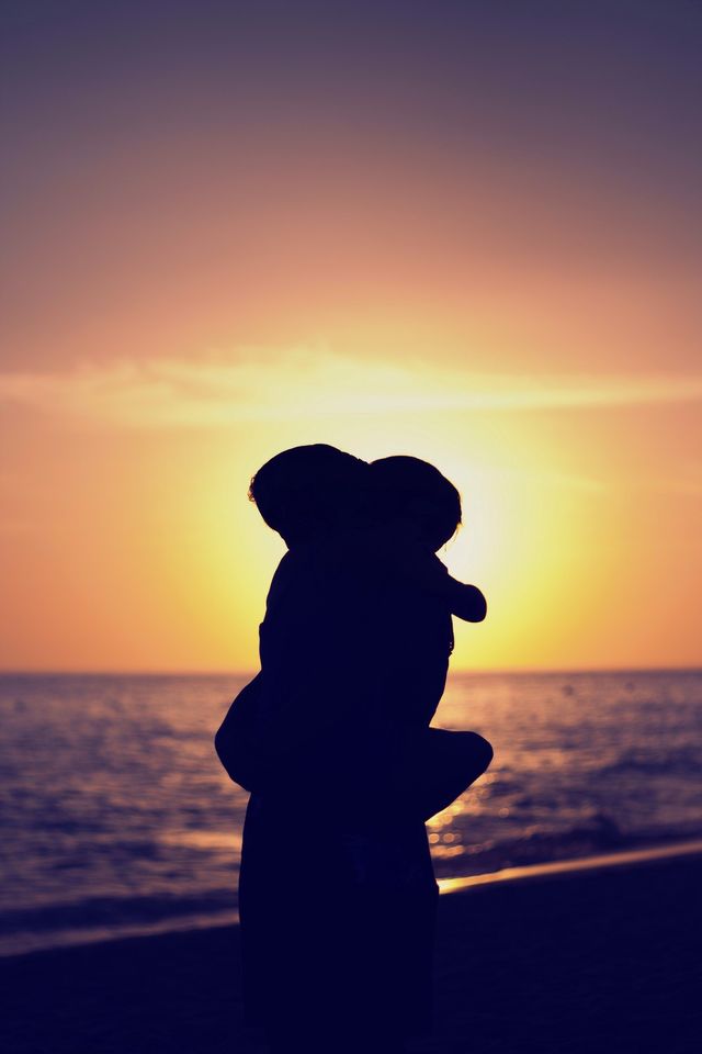 Mother and daughter hugging