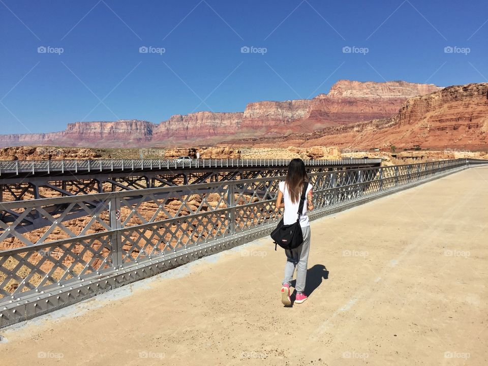 Woman is standing on the Marble canyon bridge.Utah