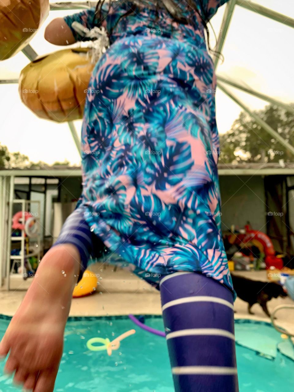 Smiley Faces Helium Balloons Seem To Pull The Girl Up In The Air While She Jumps In The Water With It In The Pool Also Having Fun For Summer Seeing From The Child’s Back.