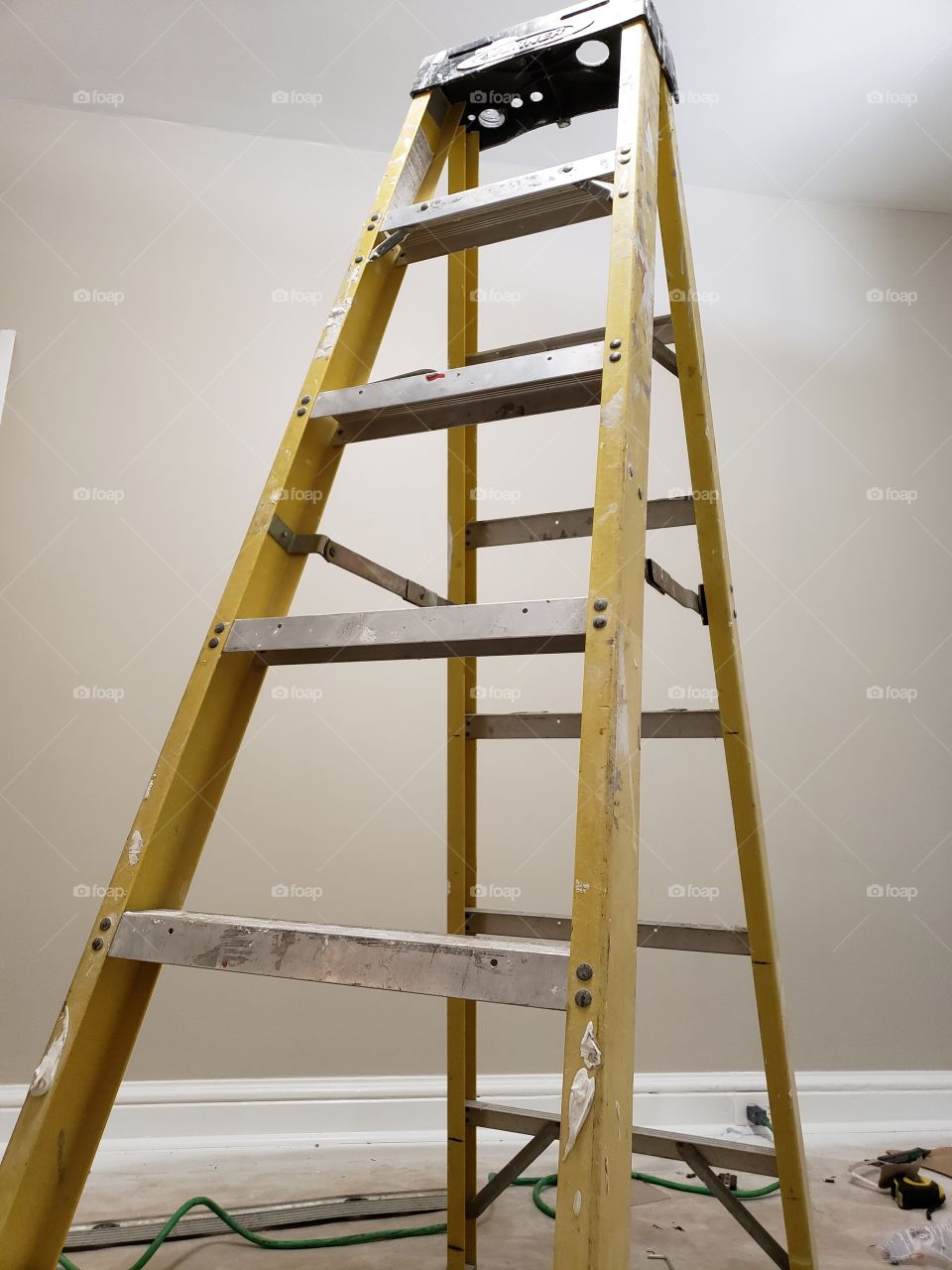 yellow ladder in construction room