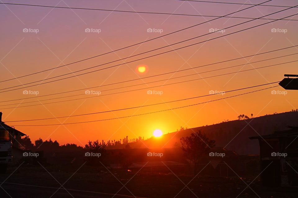 Panoramic view of colorful sunset in the mountains.