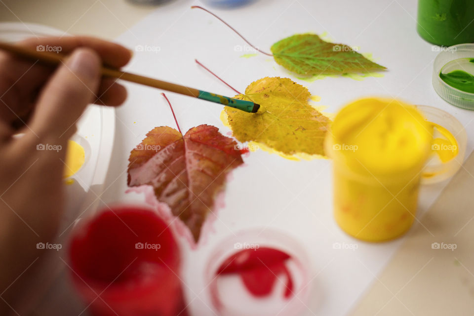 Painting autumn leaves on paper