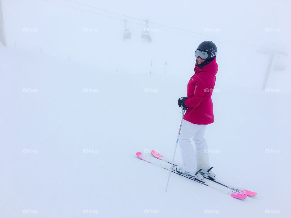 Smiling woman skiing in winter