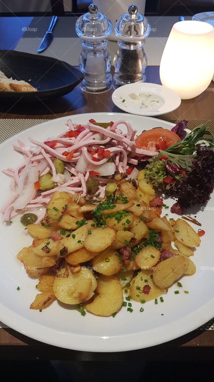 sausage salad with fried potatoes