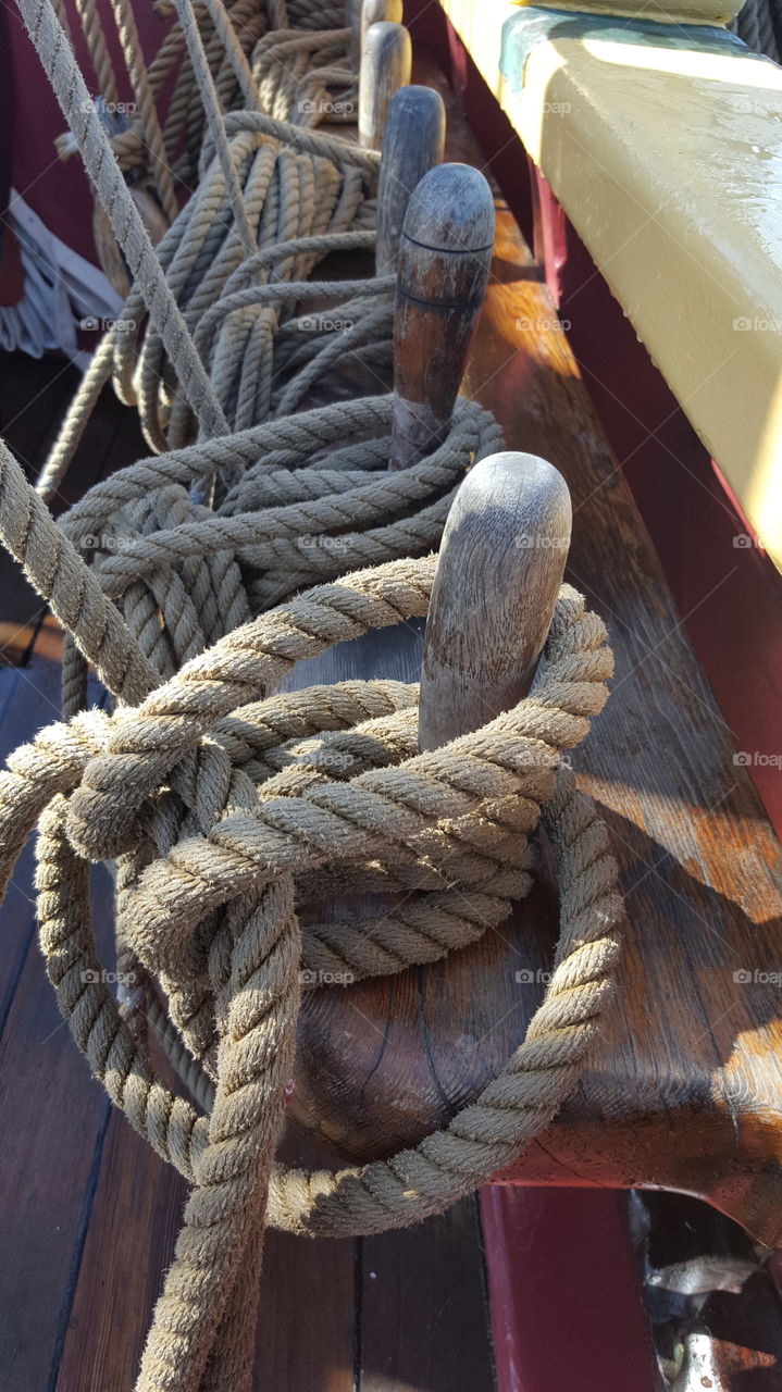 sailing ship's rigging on wooden belaying pins on Monterey.