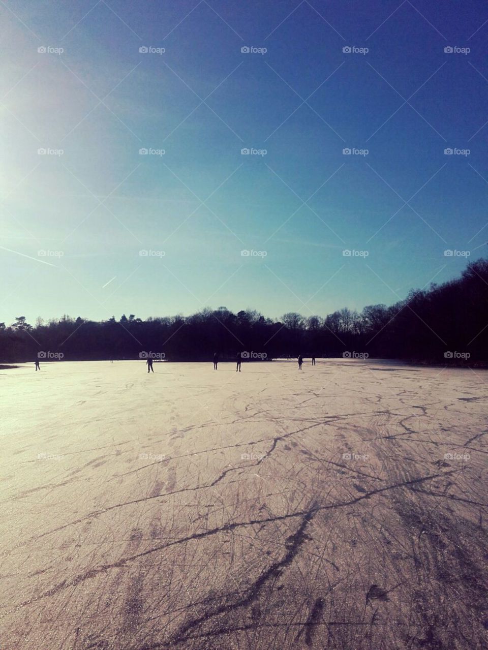 Ice skating on frozen lake winter fun