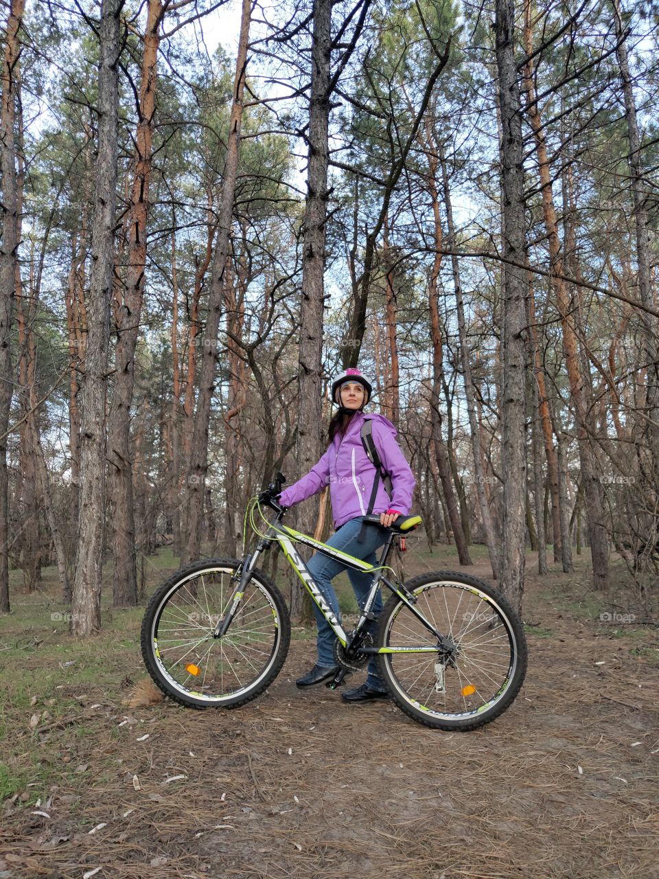 girl with cycle in the forest
