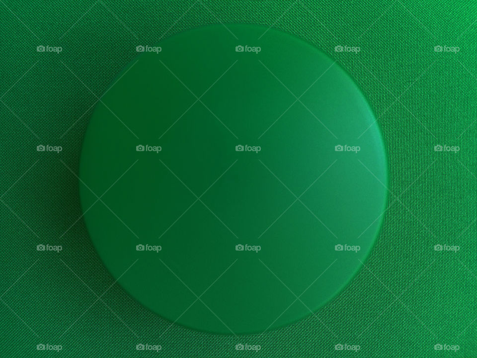 Close-up of green button