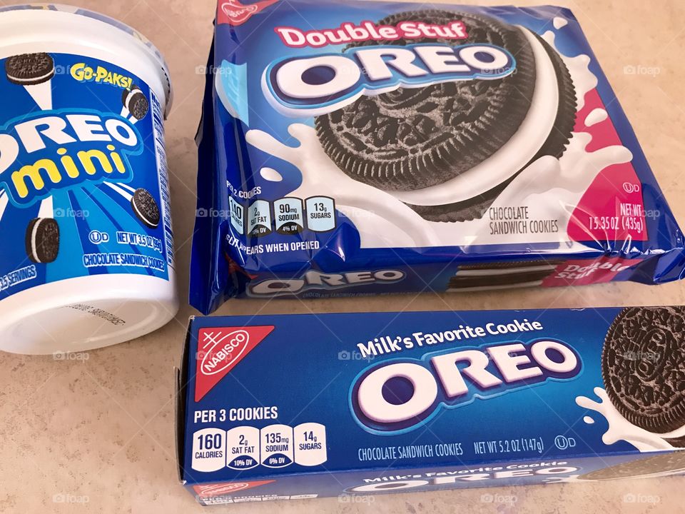 Mini and double stuf Oreo cookies flat lay on a counter top 