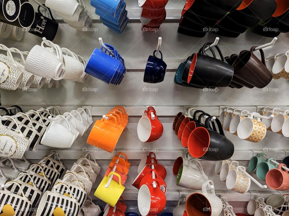 colourful hanging coffee cups and mugs in shopping mall