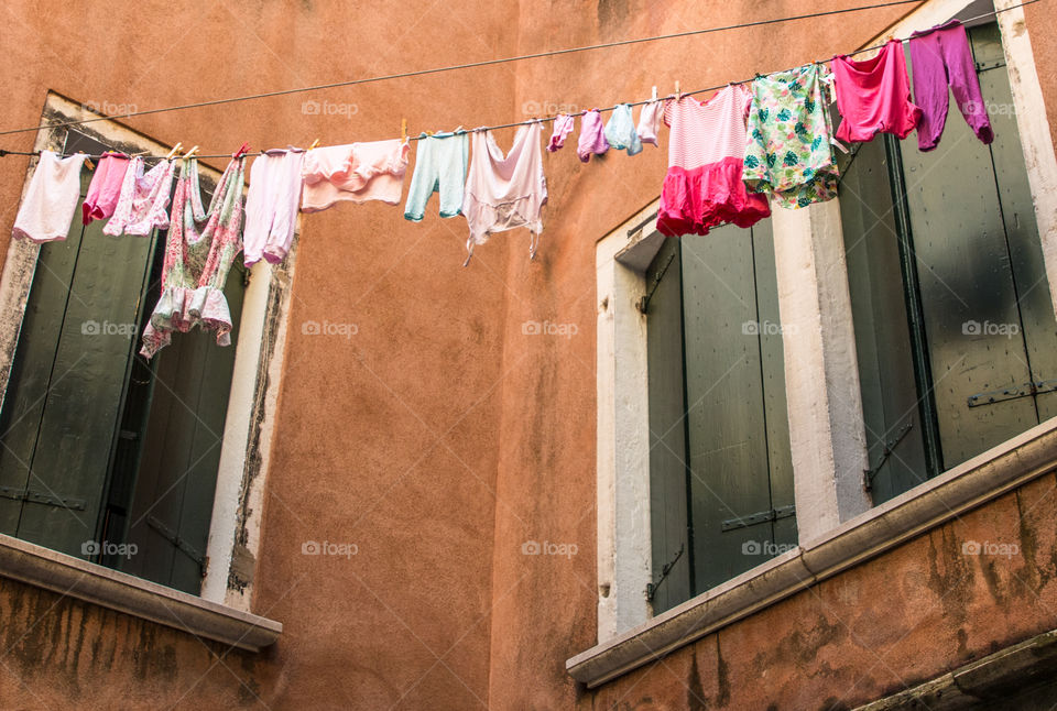 Windows And Hanging Laundry In Venice, Italy
