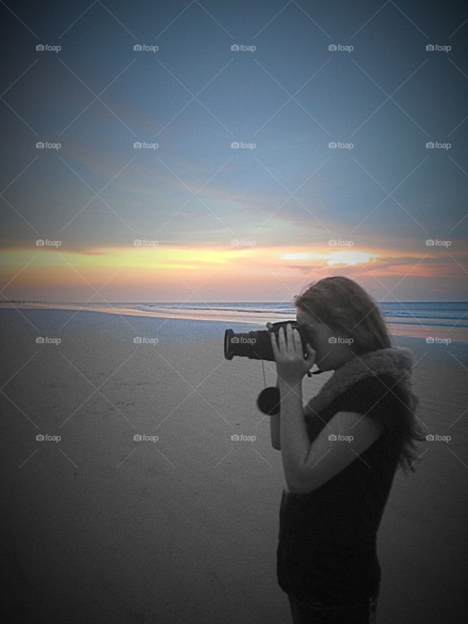 Photographer in training. My Beautiful niece too my camera and started shooting during the sunset at the beach