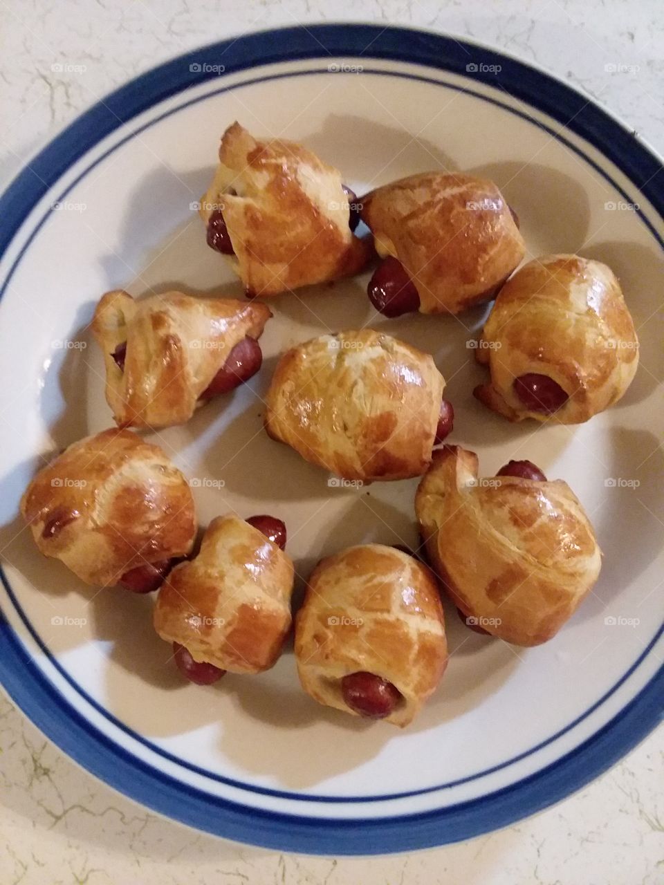 Pigs in blankets on a dinner plate