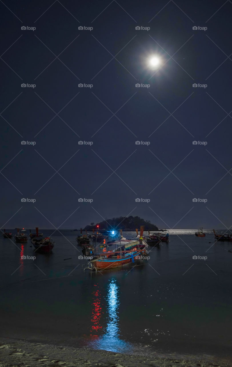 Boat in full moon background