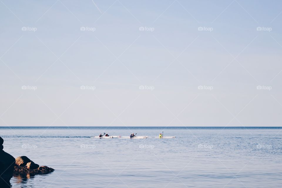 People kayaking in the ocean